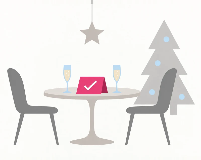 Table de restaurant avec deux coupes et des décorations de fêtes.
